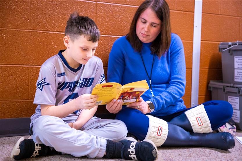 Students read to volunteers